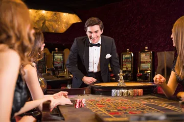 A stylish woman beside vibrant slot machines displaying glowing sevens, showcasing the variety of top slots at MALIWIN.