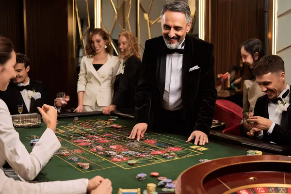 A confident dealer surrounded by casino chips inviting players to access their MALIWIN account, reflecting quick and easy login options.